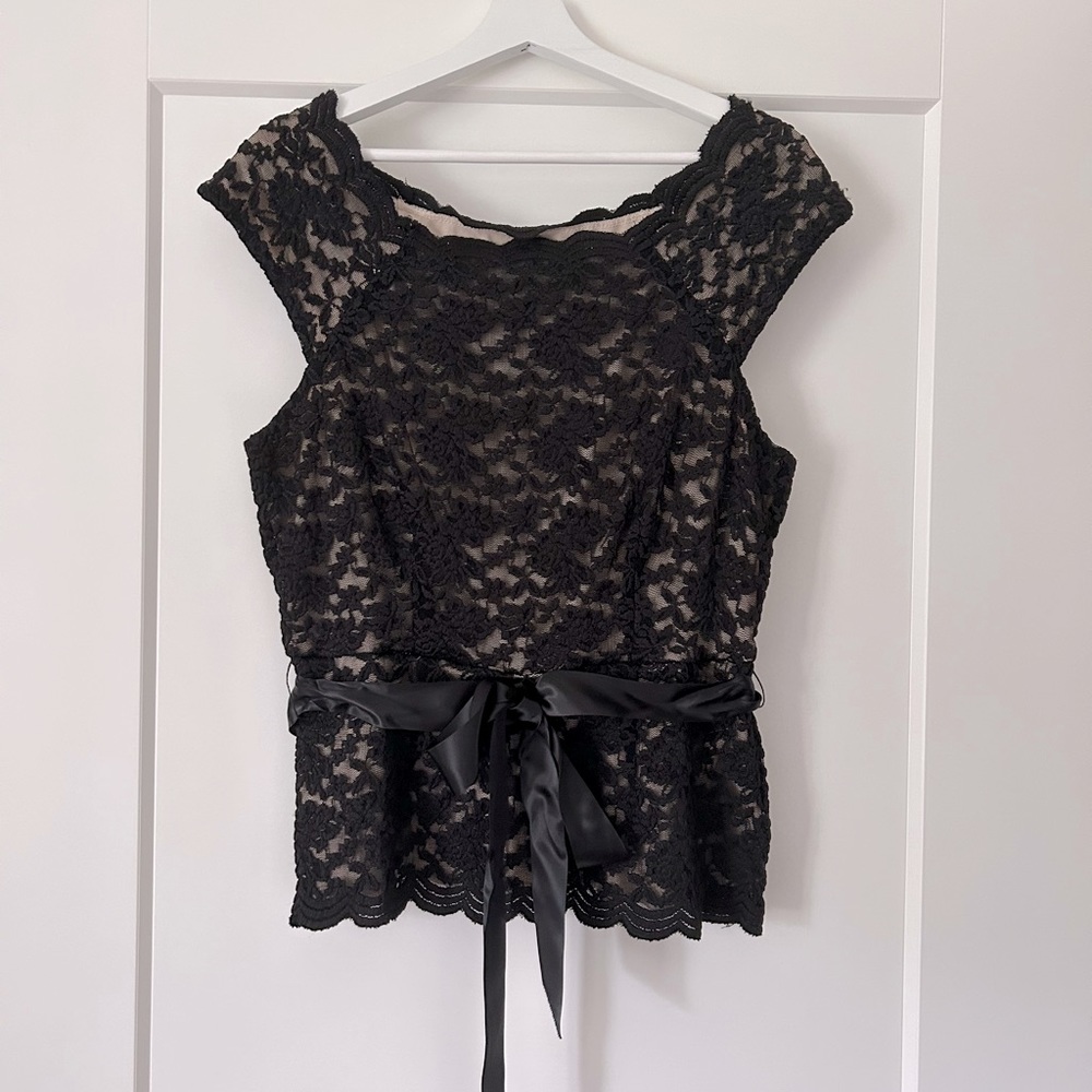 Wear it to a wedding or New Year’s Eve!  Elegant black lace top.